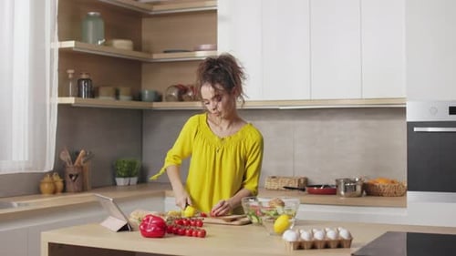 Woman Preparing Healthy Salad in Modern Kitchen
