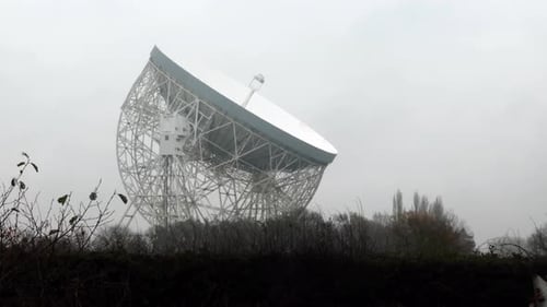 Large Satellite Dish Against Overcast Sky