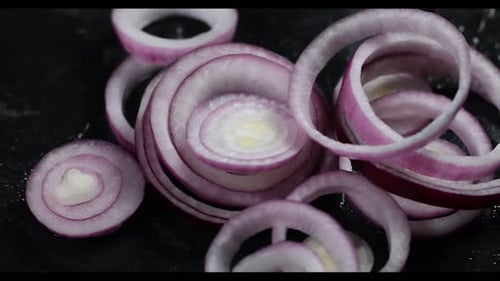 Red onions on a dark background
