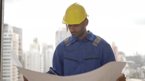 Engineer is working at tower.