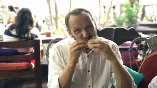 Funny, Hungry Man Eating Sandwich in Cafe 30s