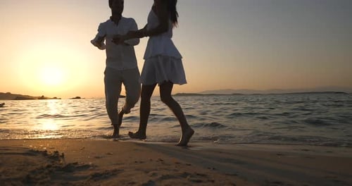 Romantic Couple Dancing on Beach at Sunset