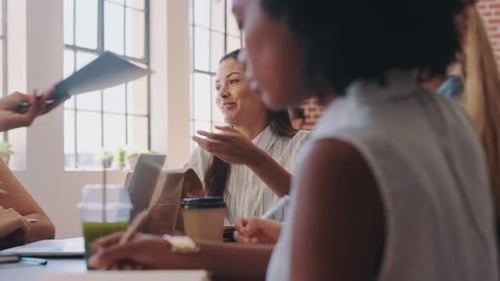 Woman, smile and work in meeting in office, team working on project or planning at marketing