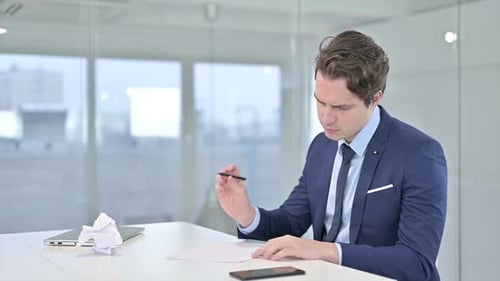 Young Adult Man Working at Desk
