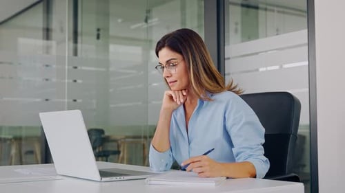 Busy Middle Aged Professional Business Woman Working on Laptop in Office