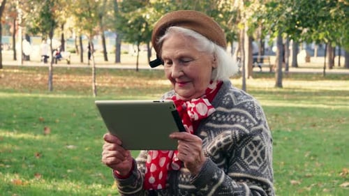 Old Senior Woman Enjoying Tablet Pc Experience