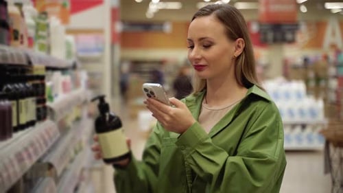 Woman Scanning Product Ingredients with Smartphone at Store