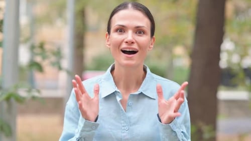 Woman Reacts with Surprise, Joy, and Gratitude