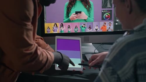 Man and Woman Working with Technology in Office