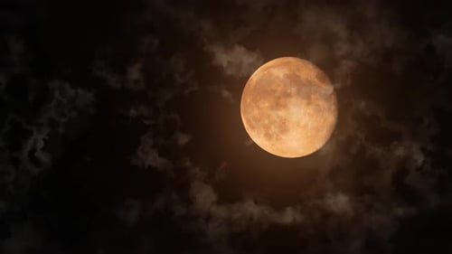 Full Bright Moon with Craters Behind Moving Clouds and Small Streams of Rising Warm Air Close Up