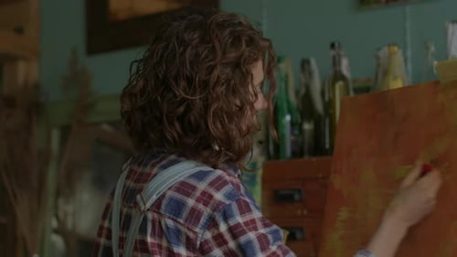 Woman Painting at Easel in Art Studio