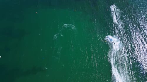 Aerial Footage of Jet Ski Racing Competition Capturing Highspeed Turns on Emerald Green Water The