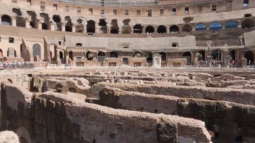 Tourists visiting the Colosseum in Rome, Italy. Wide panning shot
