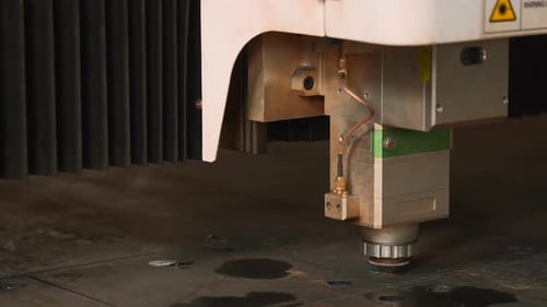 Laser Cutter Precisely Cutting Metal Sheet