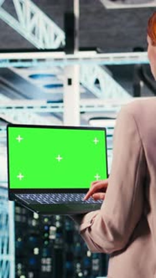 Vertical Video Green Screen Mockup Laptop Used By Server Hub Worker to Do Maintenance
