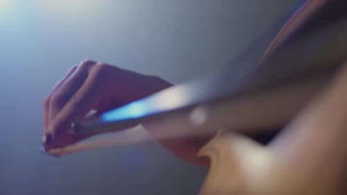 Woman Plays Cello in Close Up Shot