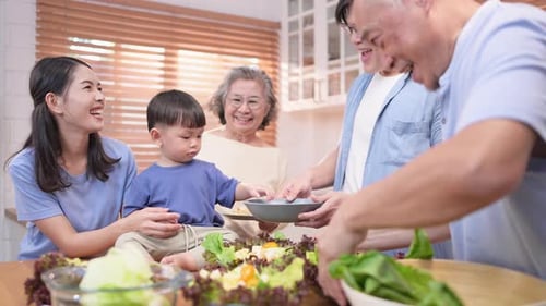 Family Preparing Fresh Salad Together in Kitchen