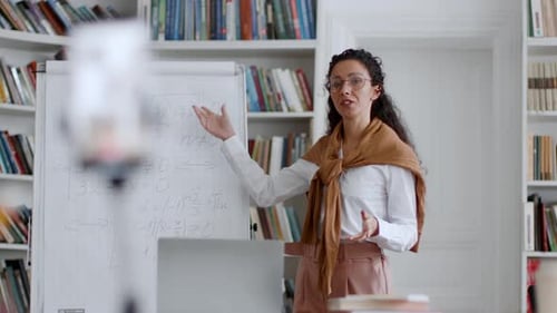 Woman Explains Math Equations During Online Class