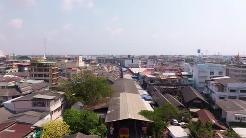 Drone perspective of Maeklong Railway Market at Talad Rom Hub, Thailand
