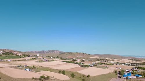 view of the field and village among the hills