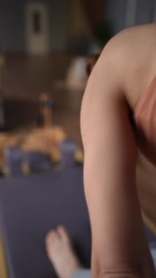 Woman Training Pilates on the Reformer Bed Reformer Pilates Studio Machine for Fitness Workouts in