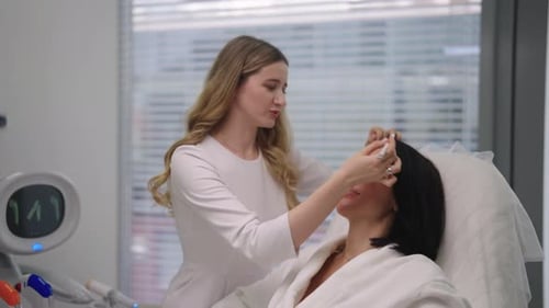Cosmetic Doctor Examining Patient for Facial Treatment