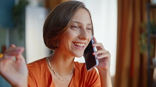 Woman Chatting on Phone, Drinking Coffee at Home