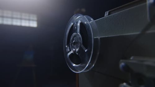 A Stylish Vintage Film Reel Placed in a Dimly Lit Studio Setting Evoking a Nostalgic Atmosphere