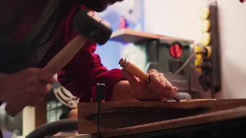 Artist Uses Vice Tool to Clamp Piece of Wood Shaping Log
