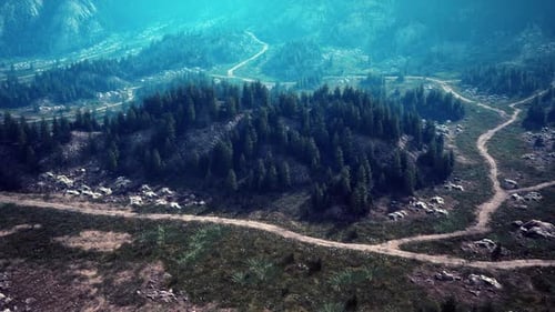 A Winding Dirt Road Through Majestic Mountain Landscapes