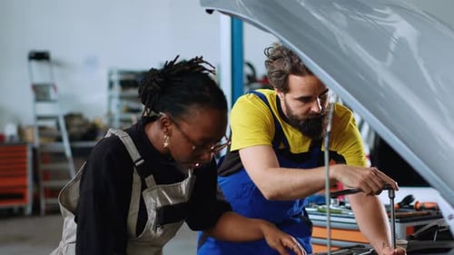 Coworking Technicians Fixing Car