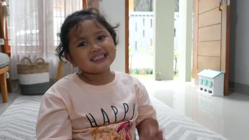 Cute Child Eating Noodles Indoors and Making Peace Sign