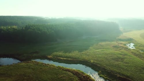 Summer Green Fields And River Nature Park In Morning Mist