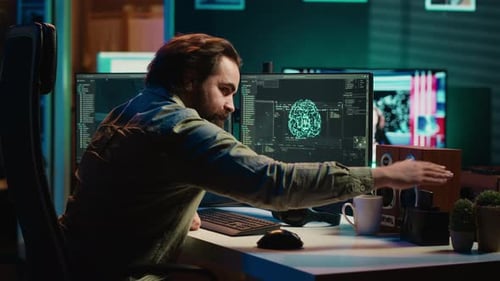 Man Developing AI on Computer in Office