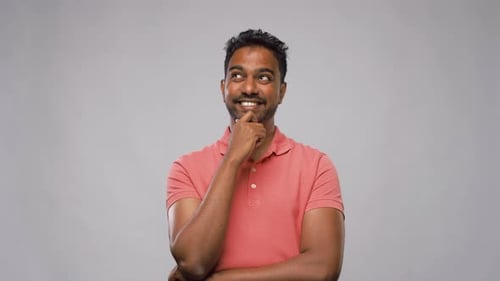 Man Thinks then Has Idea, Smiles and Points Up