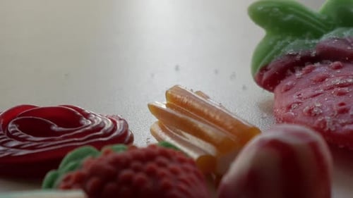 Close-up and panning movement of some jellies on a table in studio enviroment at home.
