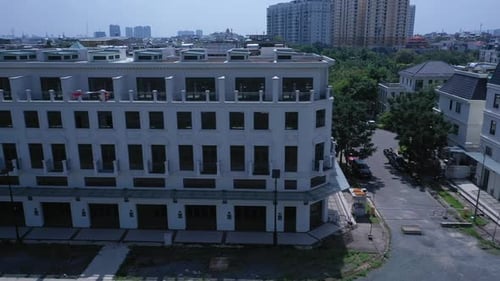 Long tracking shot along housing estate facade on Sunny Day. New development in European style with