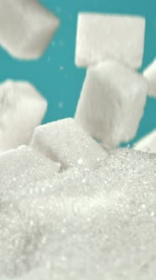 Cubes of Refined Sugar Fall Into a Pile of Sugar Filmed on a Highspeed Camera at 1000 Fps