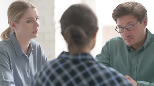 Business Meeting With Woman and Man Listening