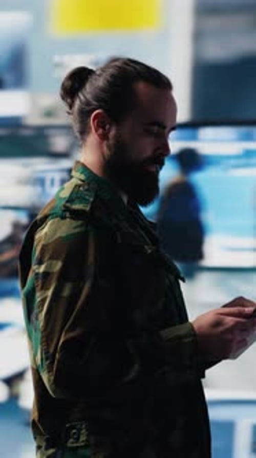 Vertical Video Army Officer Working in a Virtual War Zone with Digital Tech and Satellite Data