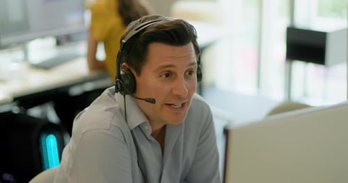 Business Man with Headset on a Video call in an Office, Telemarketing, Call centre