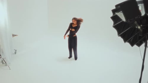 Young Girl Performing Contemporary Dance Moves In Minimalist Studio