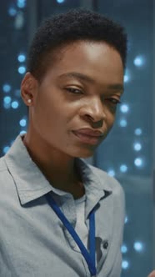 Young Adult Standing in Front of Blue Lights