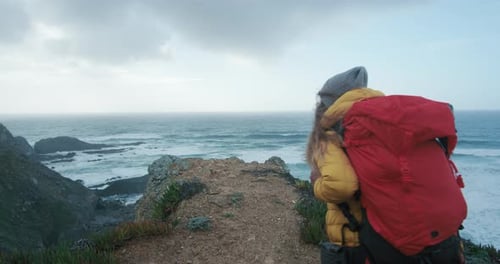 Female Hiker in Epic Cinematic Coast Scenery