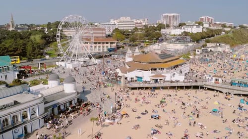 Bournemouth Pier - Aerial over beach, dolly in, pan left