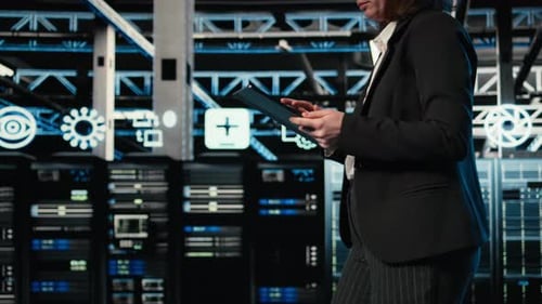 Technician Walking in Data Center Using AR Simulation to Conduct Security Audit