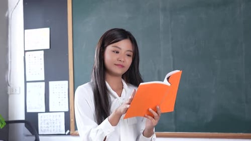 Portrait attractive of smiling Asian Teacher woman teaching student in online classroom