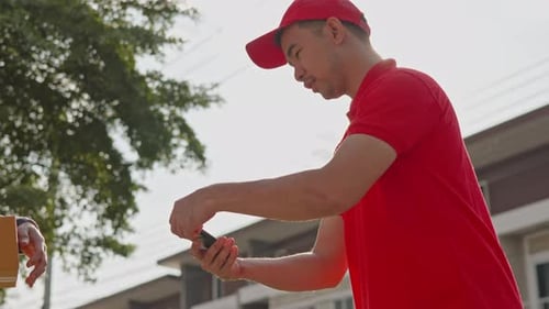 Delivery man, driver calling to customerr for sending parcel box package in the cargo truck at home