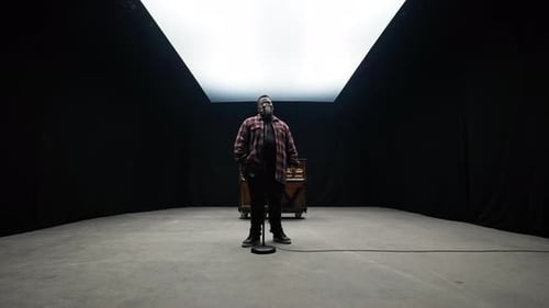 A Singer Performing In A Studio