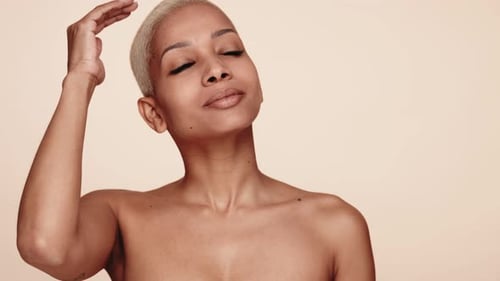 Beautiful Woman Touching Her Hair and Face